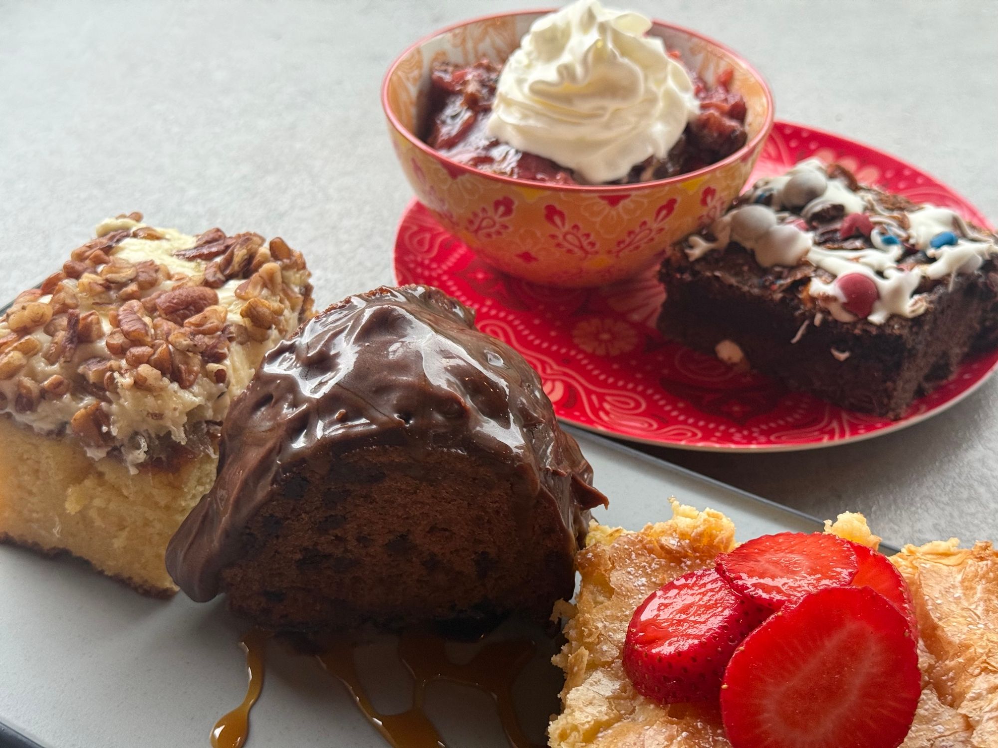 Dessert platter with cake, brownies, and strawberries